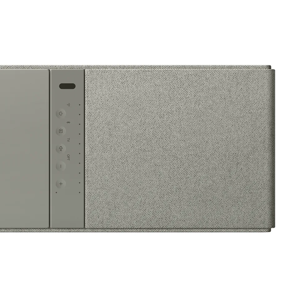 KEF XIO 頂部觸控面板特寫，可調整音量與切換音源